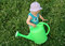 Free Litlle Girl And Watering-pot Royalty Free Stock Photos - 1010848