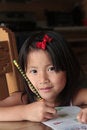 Free Smiling Asian Girl Doing Homework Stock Images - 10335714