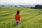 Free Girl Walking In Field Overlooking Forest And Valley Stock Image - 1223961