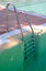 Free Steps Leading Out Of Clear Green Swimming Pool Royalty Free Stock Images - 1268729