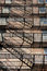 Free Zig Zagging Fire Escape On Back Of Old Apartment Building Royalty Free Stock Photos - 1304298