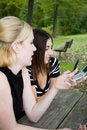 Free Friends On Cell Phone Together (Beautiful Young Blonde And Brune Stock Image - 1323071