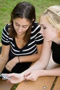 Free Friends On Cell Phone Together (Beautiful Young Blonde And Brune Stock Image - 1323161