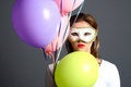 Free Brunette With Mask And Balloons Royalty Free Stock Photography - 1418527