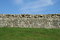 Free Stone Wall Divides Grass And Sky Stock Image - 1420571