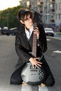 Free Smiling Young Brunette Girl With A Guitar Stock Images - 14398174