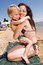 Free Young Mother Hugging Her Son At The Beach Stock Image - 15071911