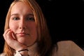 Free Attractive Young Woman With Her Chin Resting On Her Hand Stock Photography - 1517942