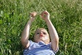 Free Kid Head Lies On Grass Stock Images - 1544364