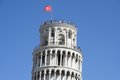 Free The Top Of Tower Of Pisa With Flag And Tourists Royalty Free Stock Photo - 1549655