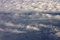 Free Jet Flying Above Fluffy Louds Royalty Free Stock Image - 1674696