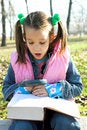Free Little Pretty Child Reading The Book Stock Photos - 1744853