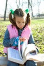 Free Little Pretty Child Reading The Book Royalty Free Stock Image - 1744886