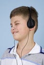 Free Young Boy Listening To Music On Headphones Royalty Free Stock Image - 1782266