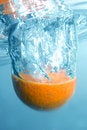 Free Fresh Orange Into Blue, Clear Water Stock Photography - 1844112