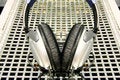 Free Symmetrical Silver Headphones On Silver Grid Background Stock Photo - 1868020