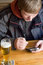 Free Man With Beer And Palm-size Computer Royalty Free Stock Photos - 1865918