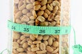 Free Peanuts In A Jar With Tape Measure Stock Images - 1874924