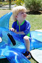 Free Young Boy Or Child Sitting On Inflatable Dolphin By Swimming Pool Royalty Free Stock Photo - 217625