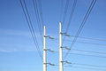 Free Two White Electricity Pylons And Stretching Wires Royalty Free Stock Photography - 2103457
