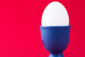 Free A White Egg In A Blue Egg Cup Stock Photo - 2158020