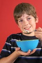 Free Boy Eating Cereal Vertical Stock Photos - 2249943
