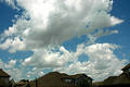 Free Clouds Over Houses Royalty Free Stock Photography - 245117
