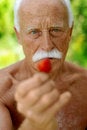 Free Senior With A Strawberry Royalty Free Stock Images - 2518609