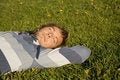 Free Man Lying On A Lawn Stock Photo - 2607650