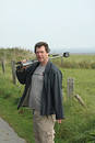 Free Man With Tripod On Shoulder Royalty Free Stock Images - 284399