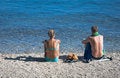 Free Couple Sit On The Beach Royalty Free Stock Photos - 3035678