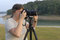 Free Pro Female Photographer W/DSLR Stock Image - 3498881