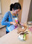 Free Woman Slices An Egg Stock Photos - 3746503