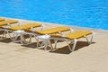 Free Pool Restbeds Around A Pool Royalty Free Stock Image - 3873486
