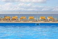 Free Pool Sunbeds Around A Pool Stock Photo - 3873740