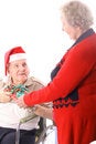 Free Elderly Man In Wheelchair Giving Wife A Present Stock Images - 3883504