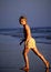 Free Young Girl Strolling Along The Beach Royalty Free Stock Photography - 4312207