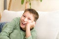 Free Happy Teenager Lie On Sofa At Home Stock Image - 4330831