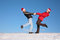 Free Couple Dance On  Snow Hill In Santa Claus Hats 2 Royalty Free Stock Photos - 4387098