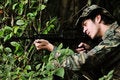 Free Soldier In Bushes Taking Aim Stock Images - 4401184