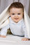 Free The Little Boy Of 7 Months Looks Out From Under Co Stock Photos - 4412503