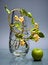 Free Glass Vase With Berries And Single Apple On Gray Royalty Free Stock Image - 4490136