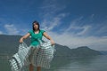 Free Woman Extending A Tablecloth Stock Photos - 4516193