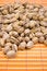 Free A Pile Of Pistachios On Bamboo Table-cloth Stock Photo - 4542490