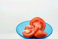 Free Tomatoes And Slices On Blue Plate Stock Images - 4584514