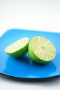 Free Limes On Blue Plate Macro Royalty Free Stock Photos - 4593358