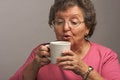 Free Senior Woman Enjoys A Mug Of Coffee Stock Image - 4894181