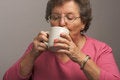 Free Senior Woman Enjoys Hot Coffee Royalty Free Stock Photos - 4894188