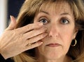 Free Woman Inserting Contact Lens In Eye Stock Image - 4925901