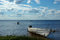 Free Lake View With Old Fishing Boat And Washing Woman Stock Photo - 5029190